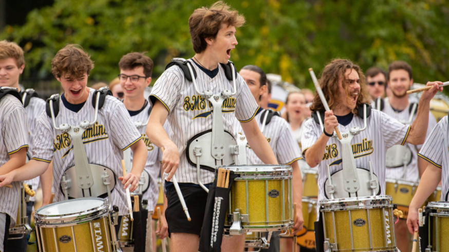 Blugold Marching Band drumline snare drummers performing outside Carson park