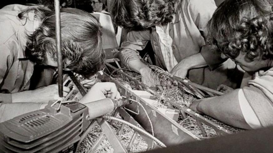 three women working on the wiring of an early Cray supercomputer