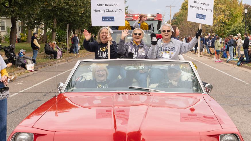 nursing alumni in a parade car HOCO 2024 