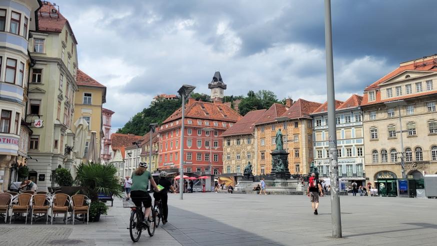 Bicyclist touring Graz, Austria