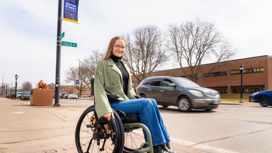 Becca Roth on Water St in wheelchair 