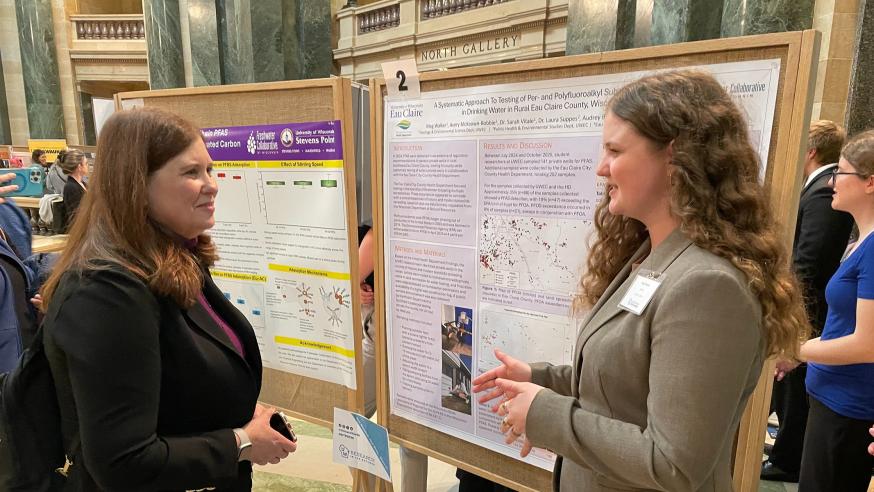 Student Meg Walker presenting poster at capitol rotunda