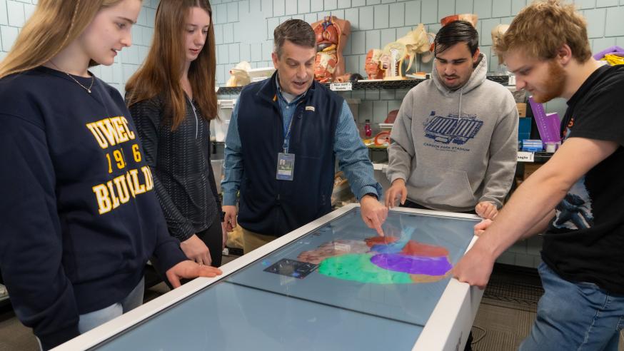 Mayo Health System medical professional, speech language therapist, Thomas Sather, discussed the human brain using Anatomage technology with honors students during an honors class.