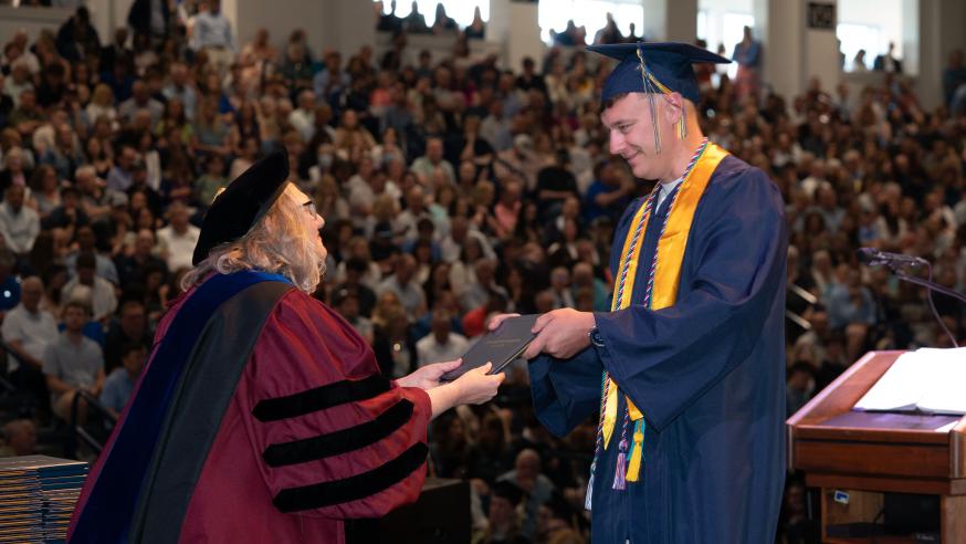 Jacob Oberg accepts his diploma 