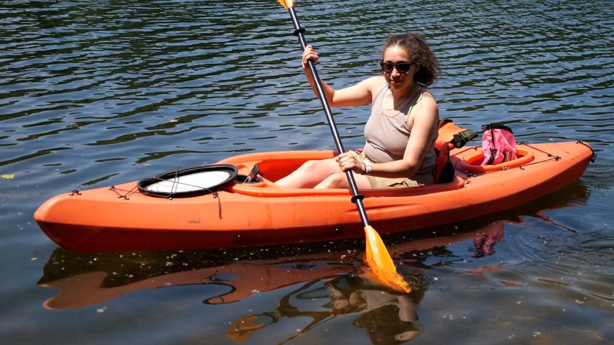 student in orange kayak 