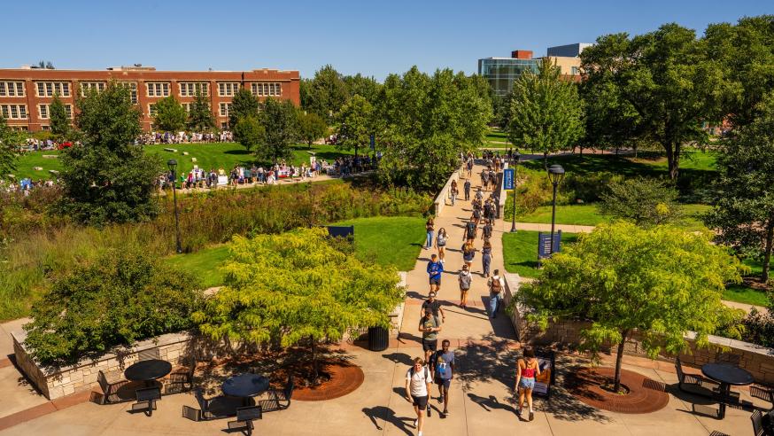 Students walking on campus on a sunny fall day