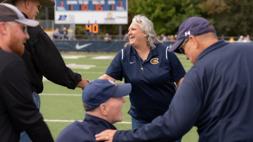 Clare Hohman shakes hands during Homecoming football game 2026