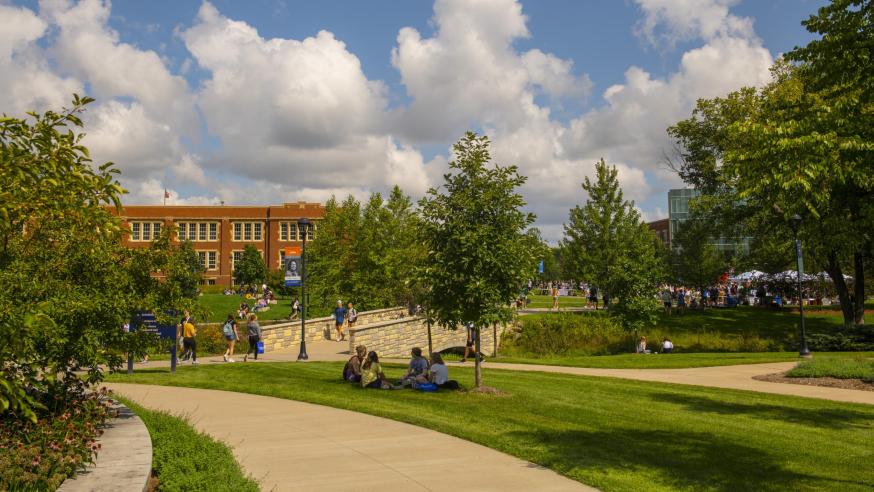 Campus mall with students in fall