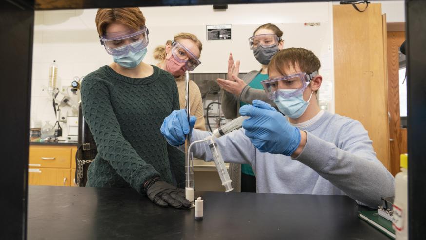 A UW-Eau Claire undergraduate research team that includes (from left) Grace Cunningham, Kira Haus, Dr. Elizabeth Glogowski and Marshall Apps will share its research with a national audience at Posters on the Hill in Washington, D.C. (Photo by Shane Opatz)