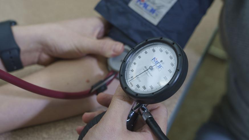 blood pressure cuff in use on a patient
