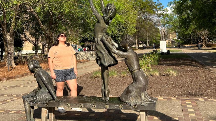 female student at the "Four Little Girls" statue in Birmingham, AL
