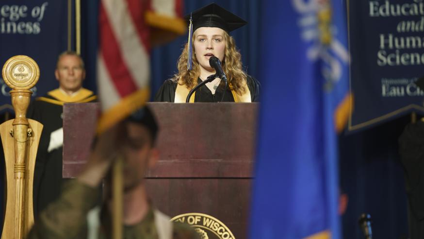 female student singing at the commencement ceremony