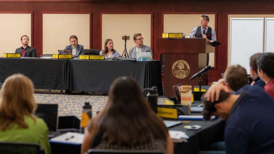 Student senate in session, enrollment management director Billy Felz at podium