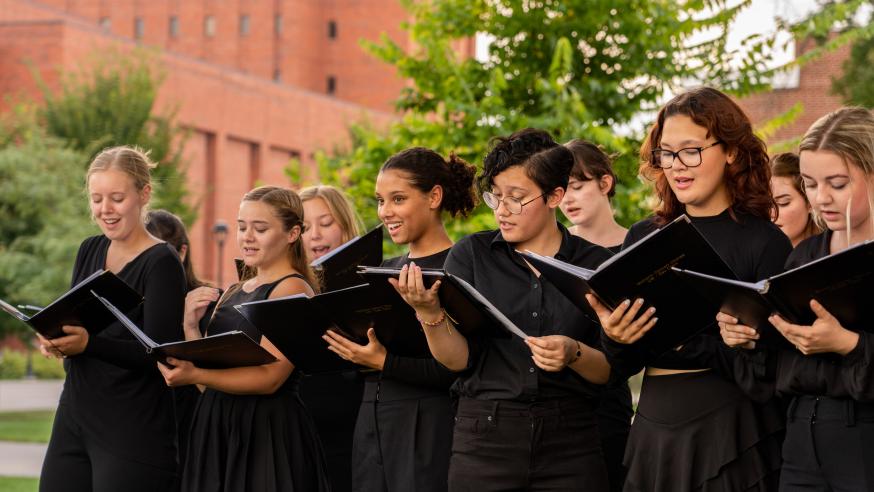 choir class enjoying an outdoor classes rehearsal session