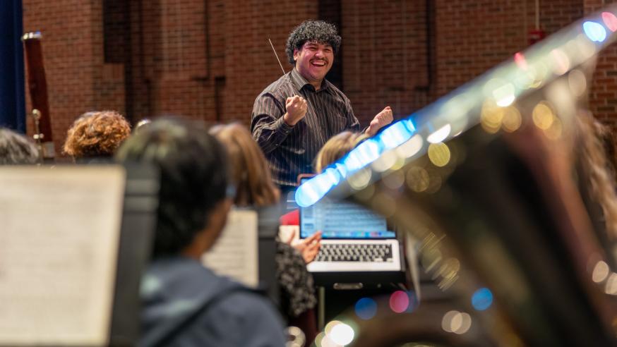 student director in a music class, laughing