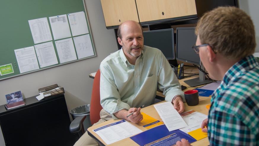 Dale Fenton advises a student Dale Fenton advises a student