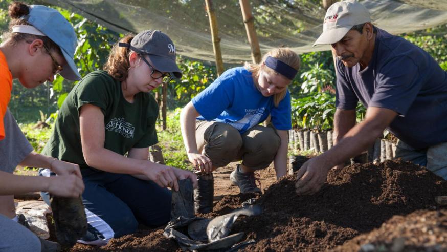 Students assisting with farming Students assisting with farming