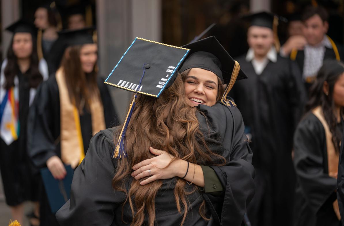 hugs on commencement day 2023