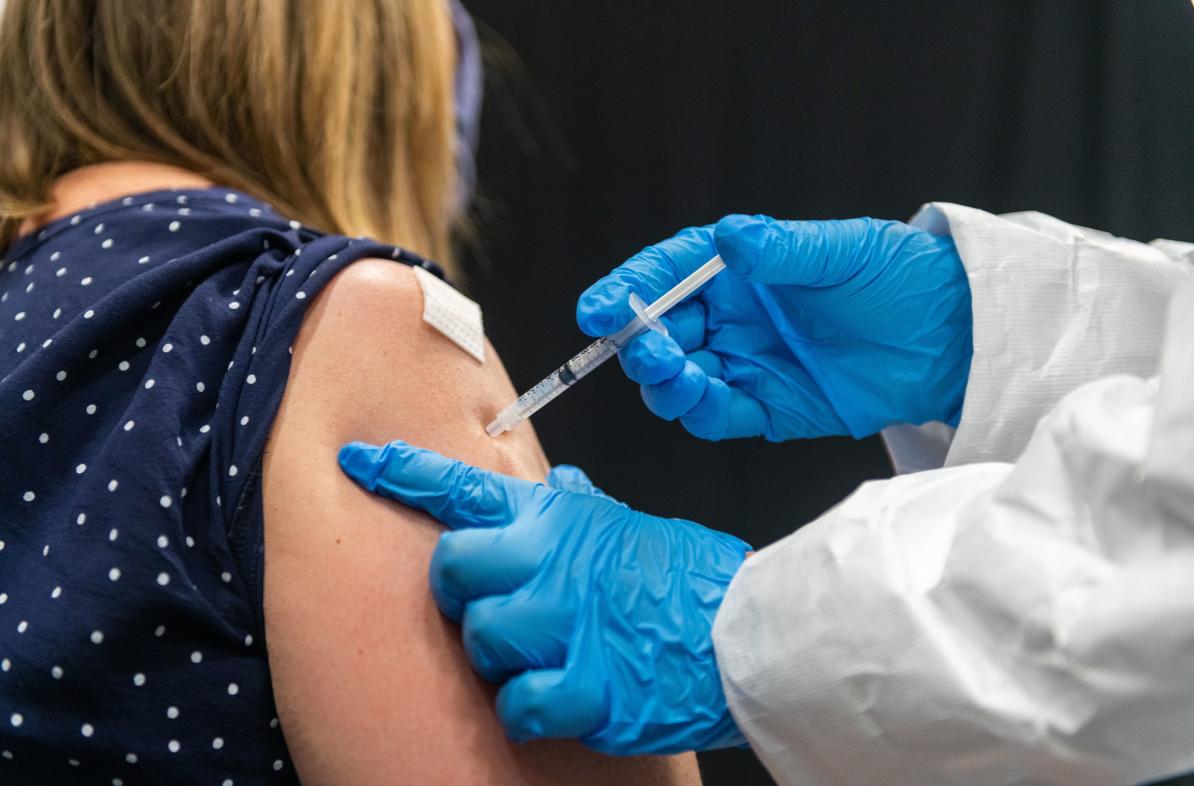 students working COVID  19 vaccine clinics 