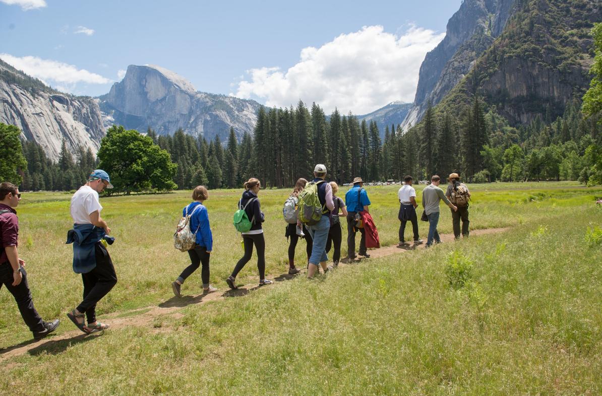 students walking a trial in a valley of Yosemite National Park