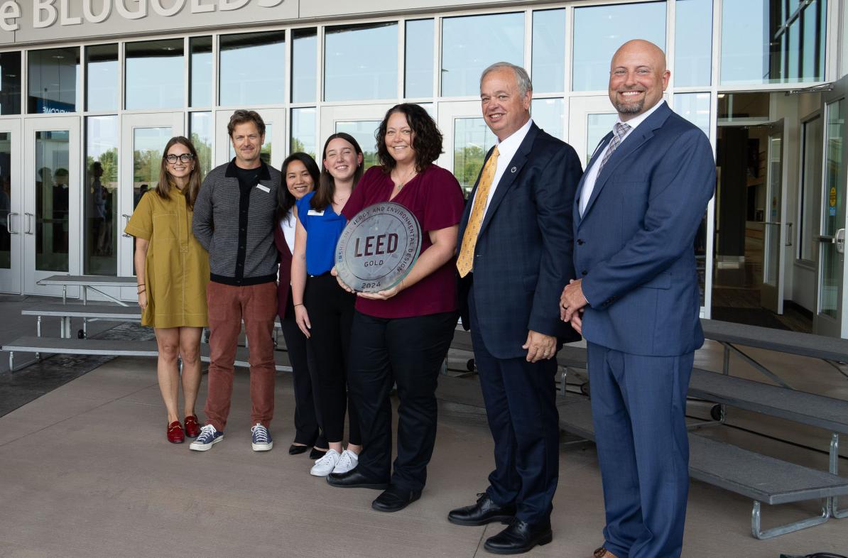 Group photo in front of Sonnentag with LEED sign