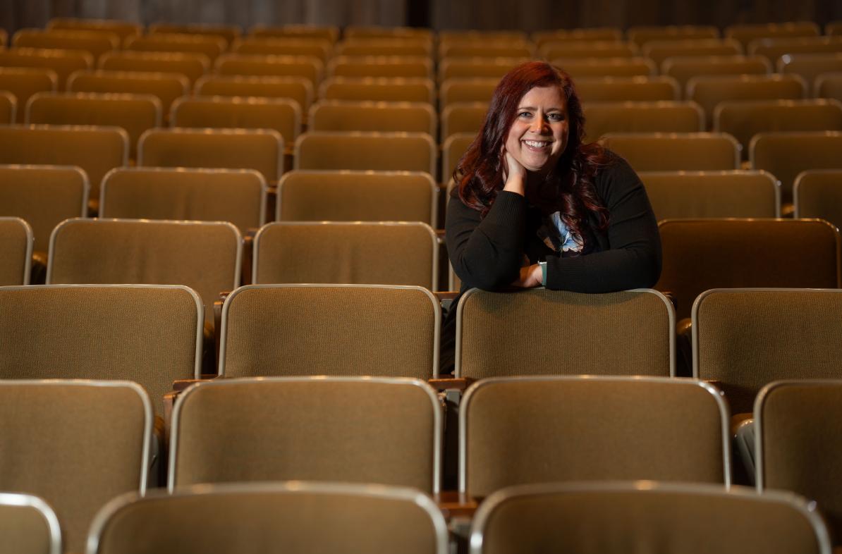 Heidi Joosten, music composition alumna in auditorium seats 