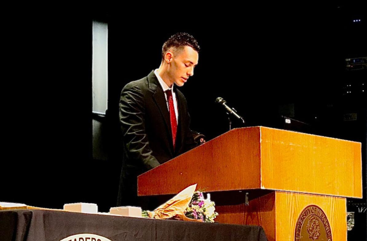 student speaks at podium