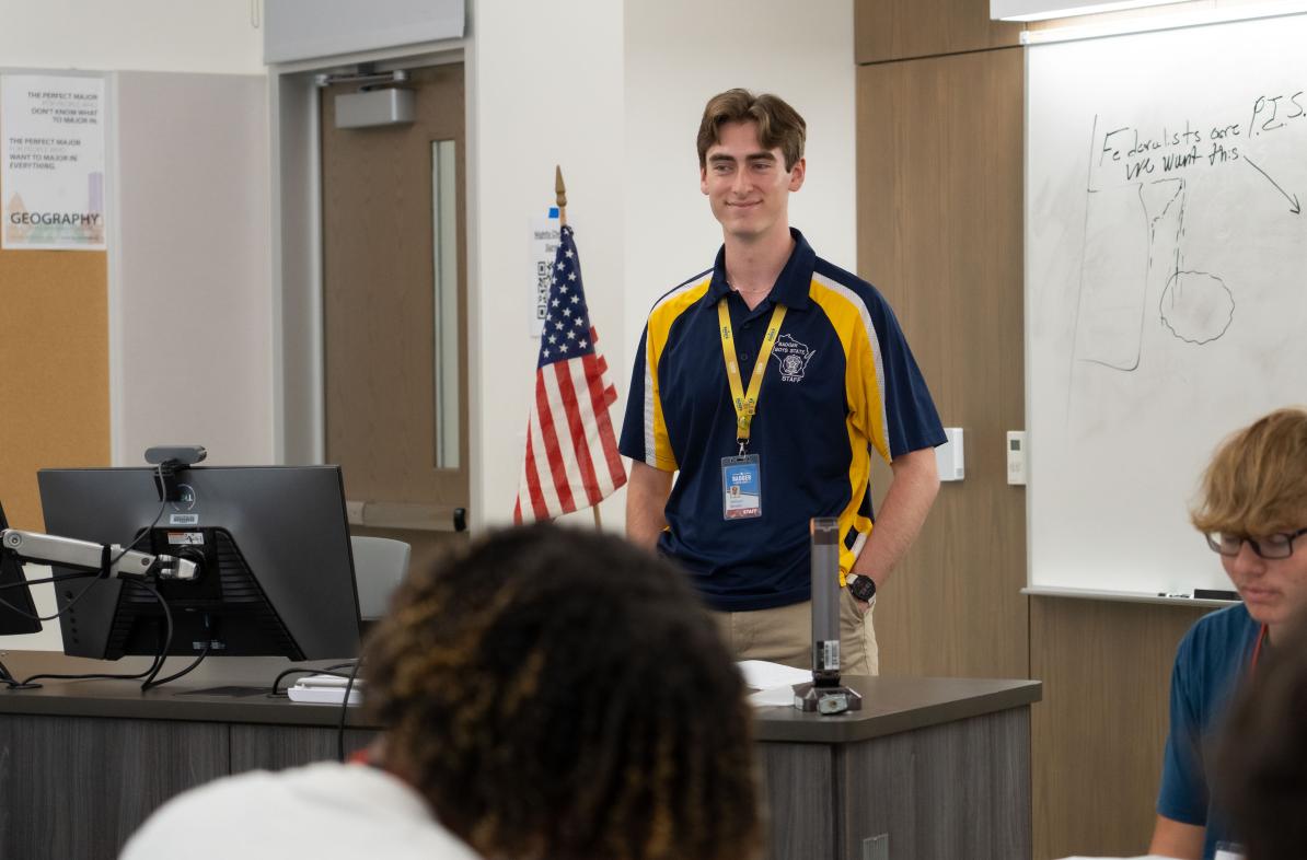 Badger Boys State staffer addressing a group of students 