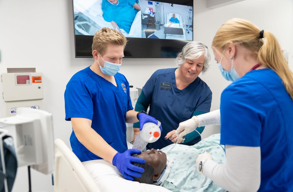 Students and dean in nursing SIM lab 