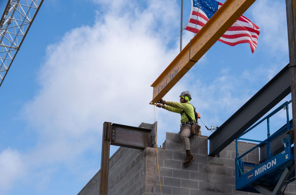 beam being set in place atop the science building 