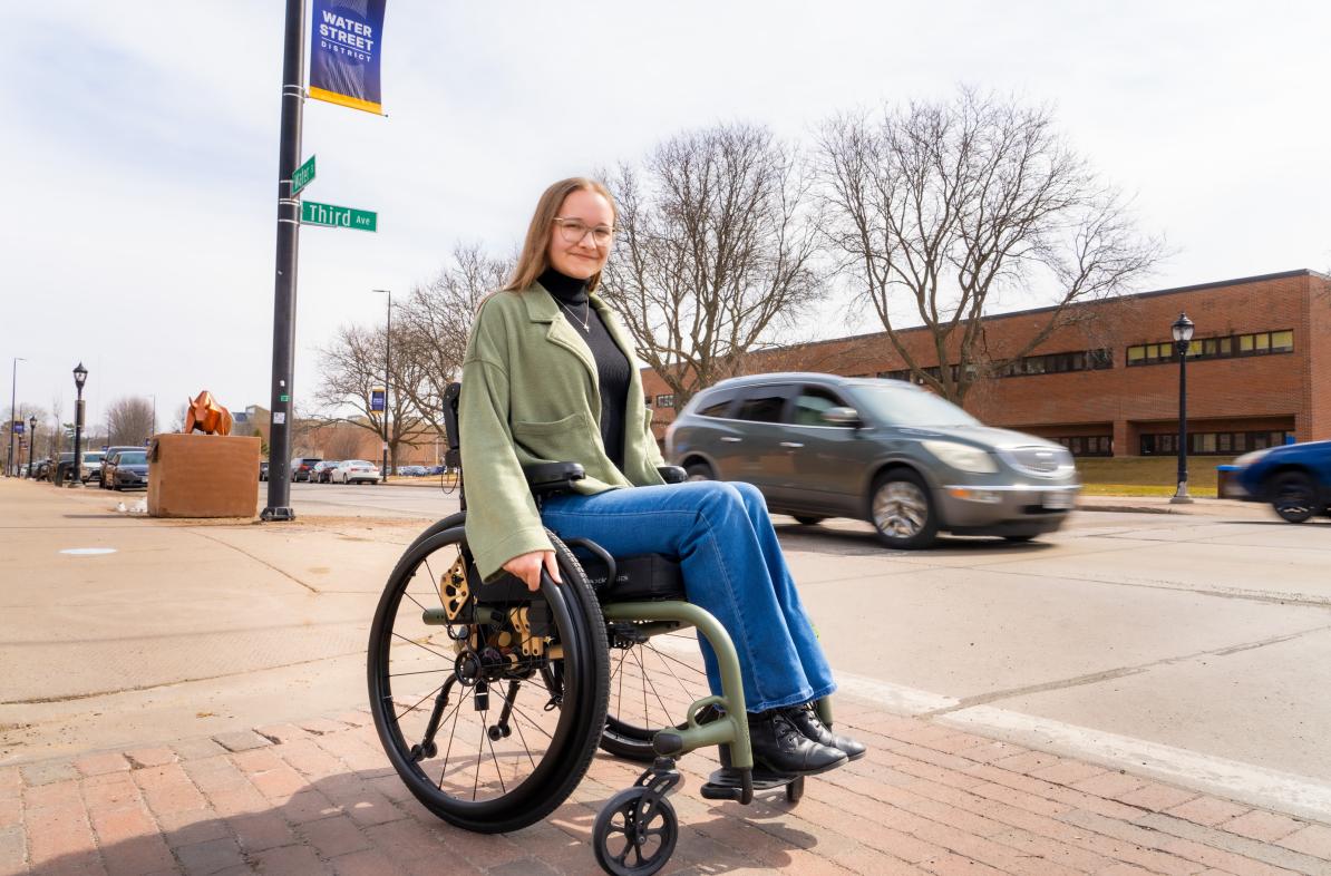 Becca Roth on Water St in wheelchair 