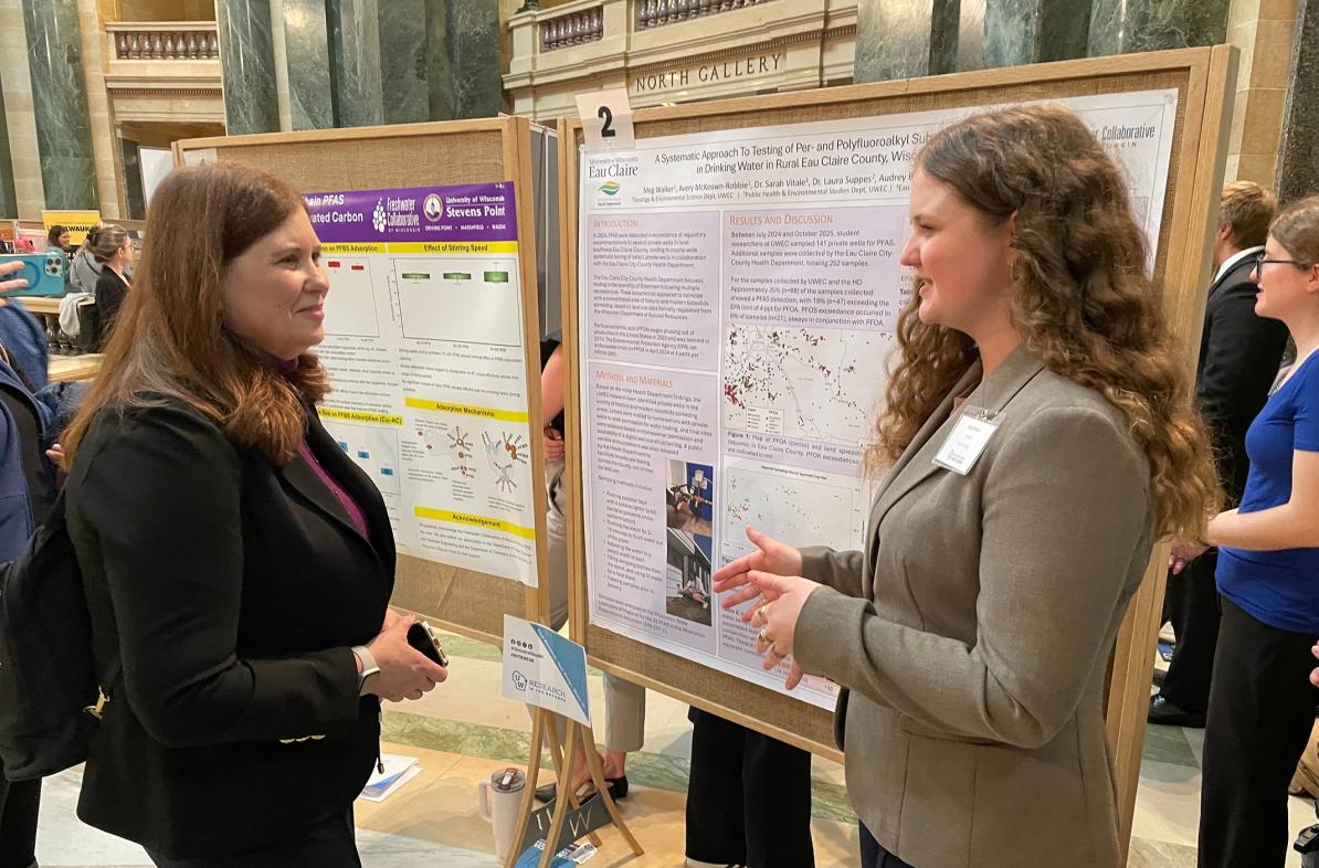 Student Meg Walker presenting poster at capitol rotunda