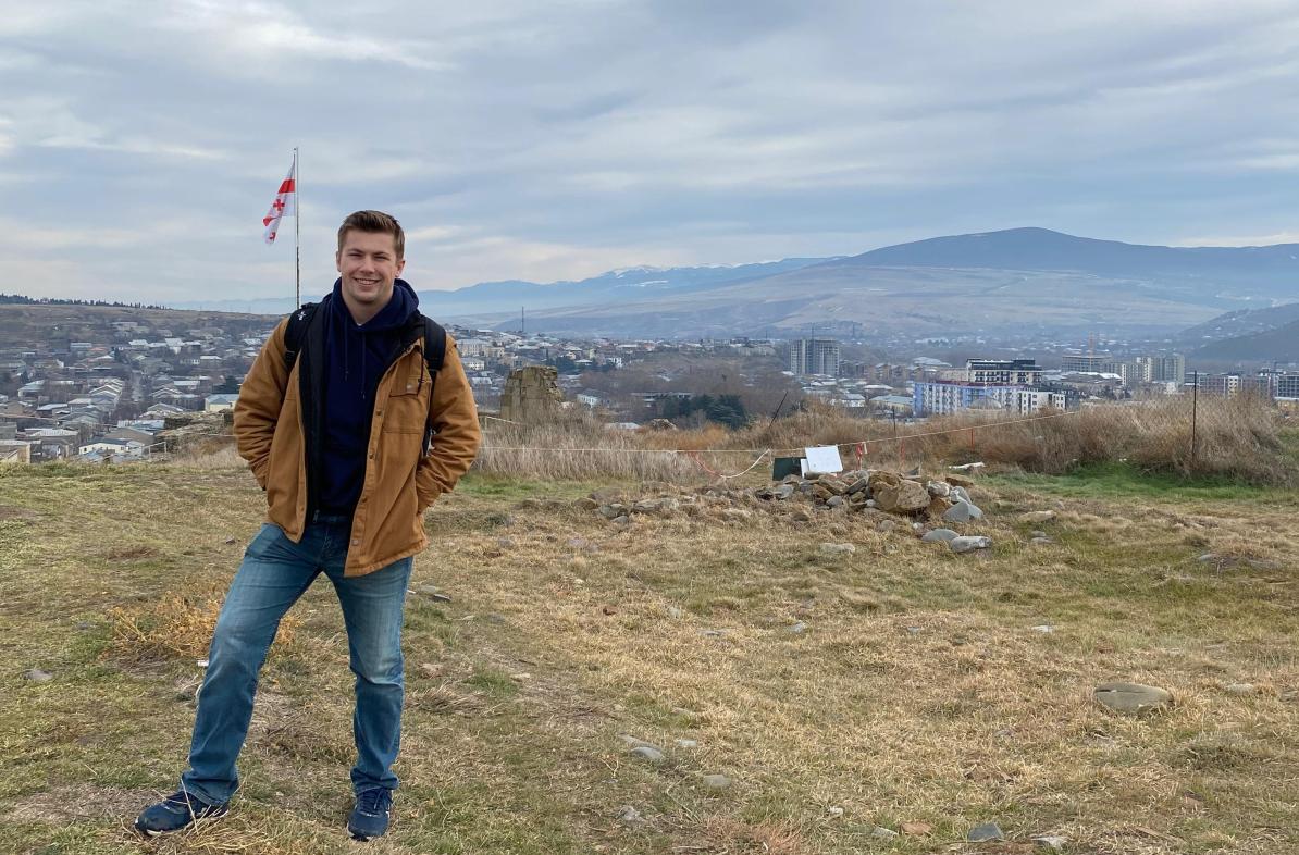McCullen Willmert stands overlooking a Georgian hillside