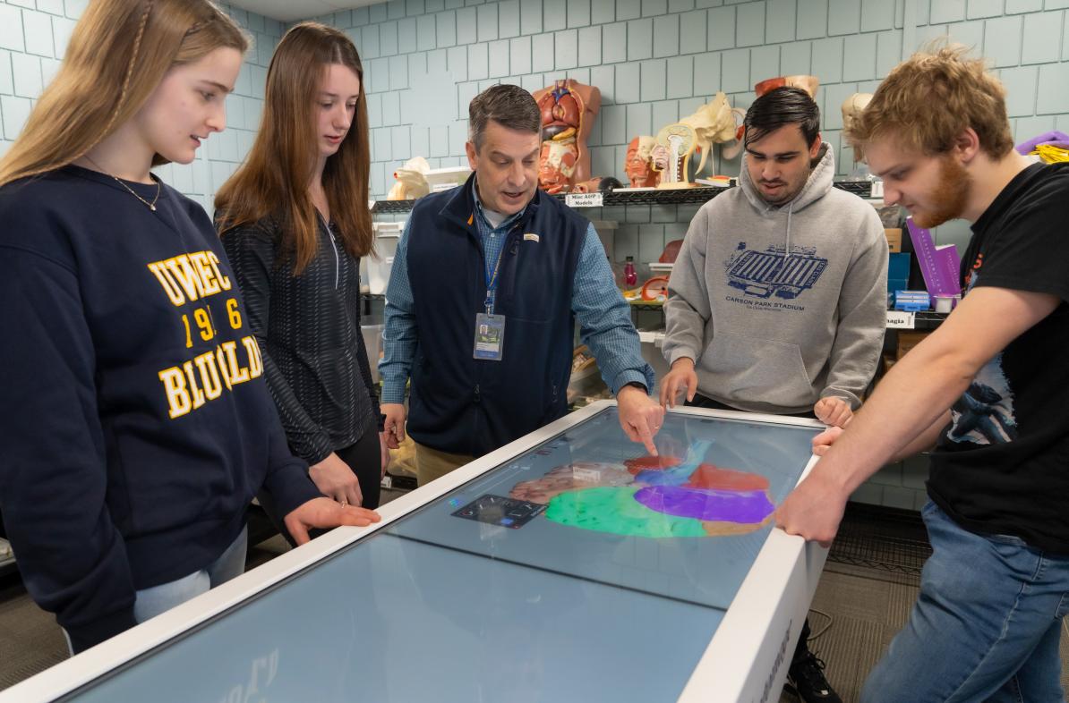 Mayo Health System medical professional, speech language therapist, Thomas Sather, discussed the human brain using Anatomage technology with honors students during an honors class.