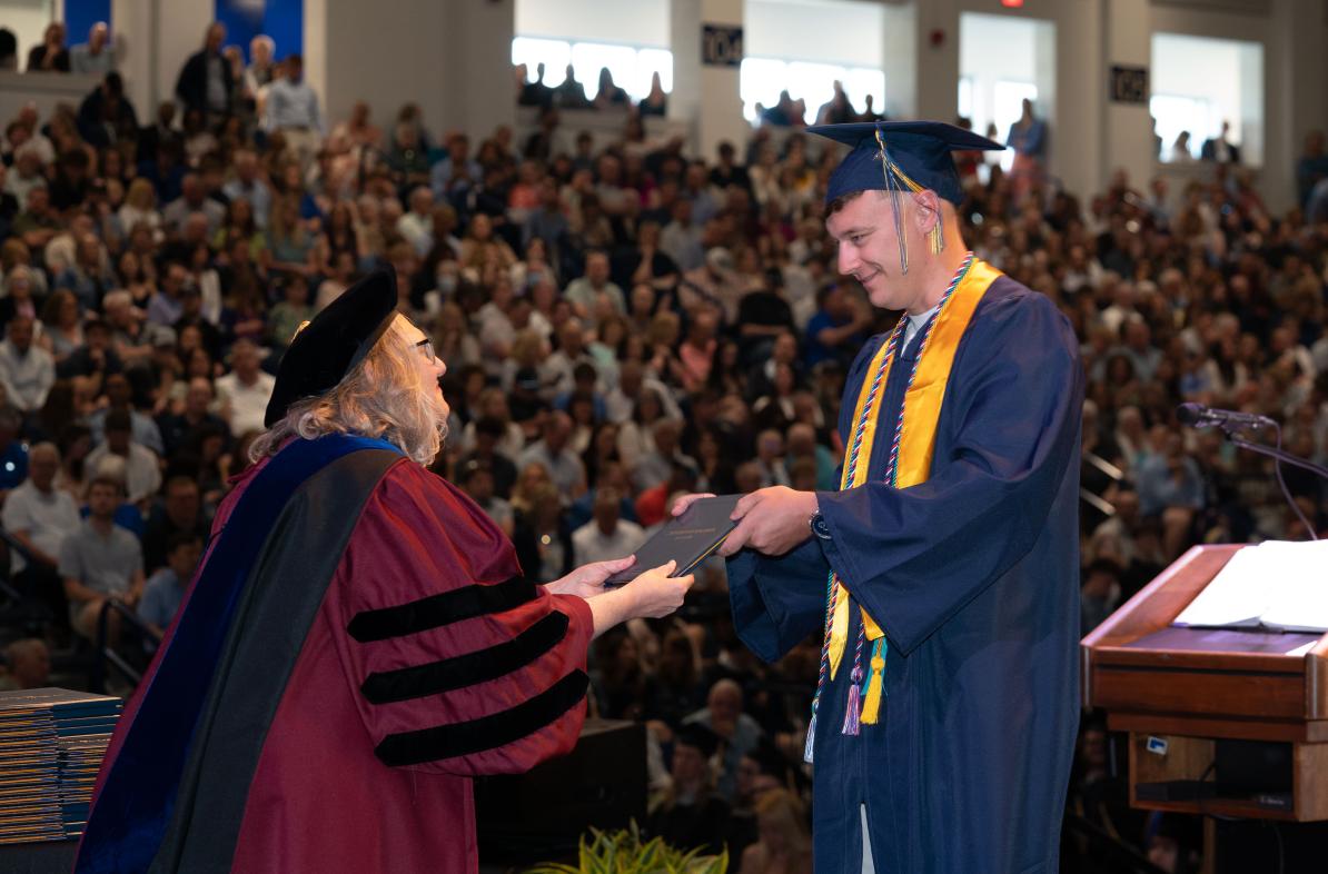 Jacob Oberg accepts his diploma 