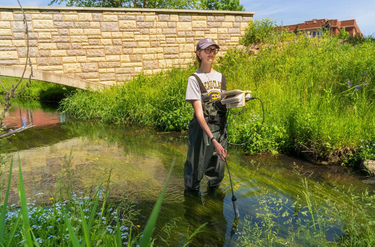 Field hydrology student in Little Niagara Creek 