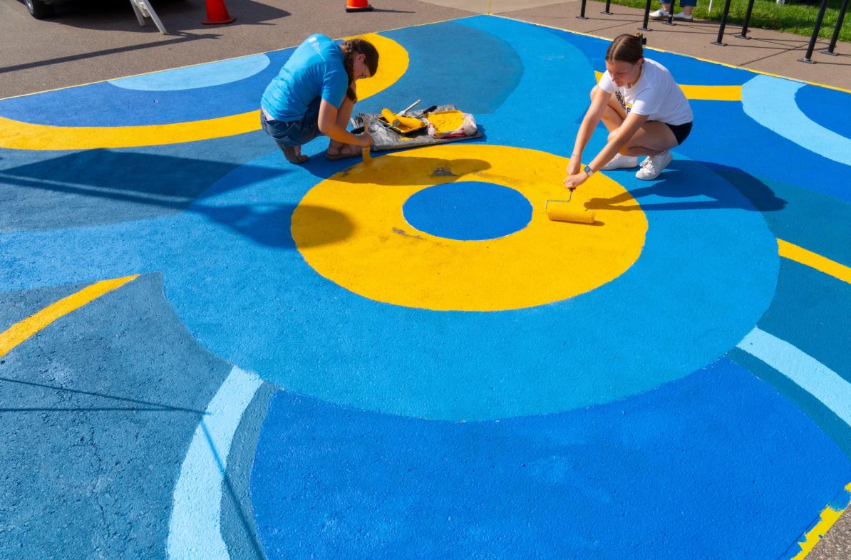 SSD TRIO Project AIM sidewalk mural painting