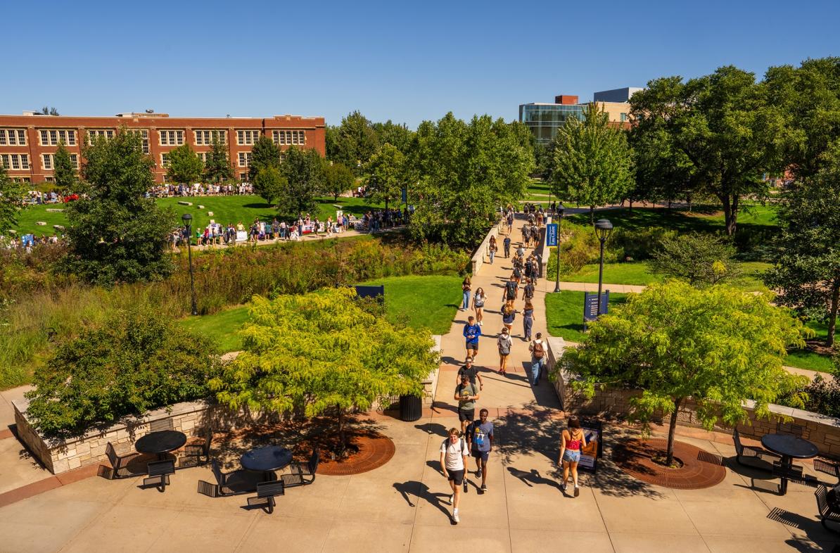 Students walking on campus on a sunny fall day