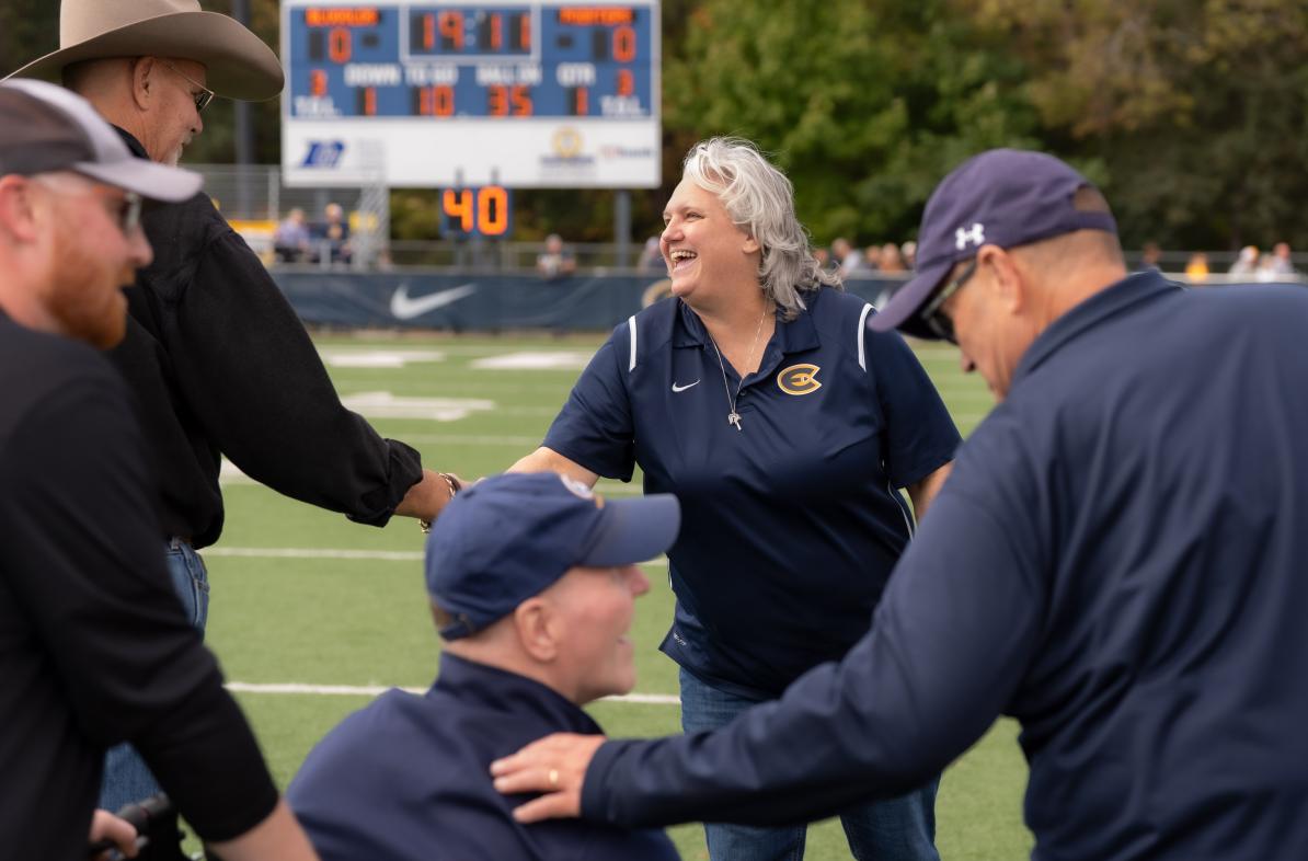 Clare Hohman shakes hands during Homecoming football game 2026