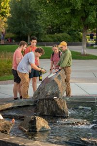 Scott Clark and students outside for class session 