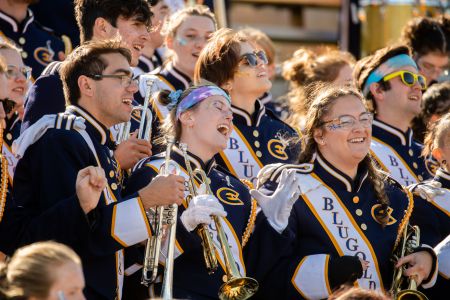 A picture of Blugold marching band with cheerful energy
