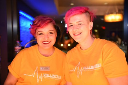 Two students smile for the camera. 