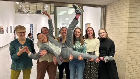 Carrie Schwartz with other students after Queer Arts Exhibition