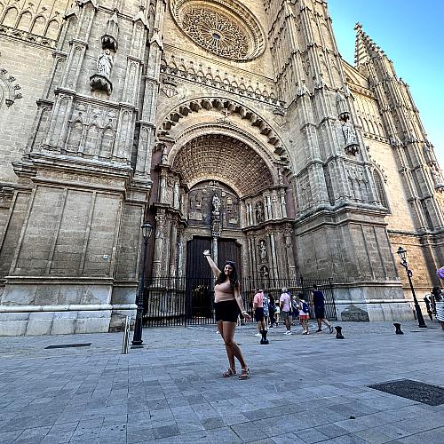 female student posing in front of Italian cathedral 