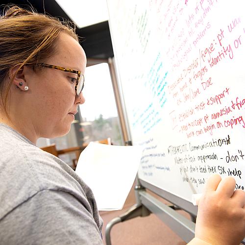 Nursing student in finals week whiteboarding 
