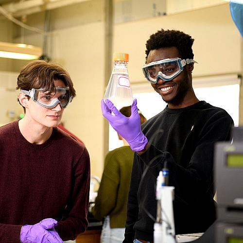 students in the chem lab holding Erlenmeyer Flask
