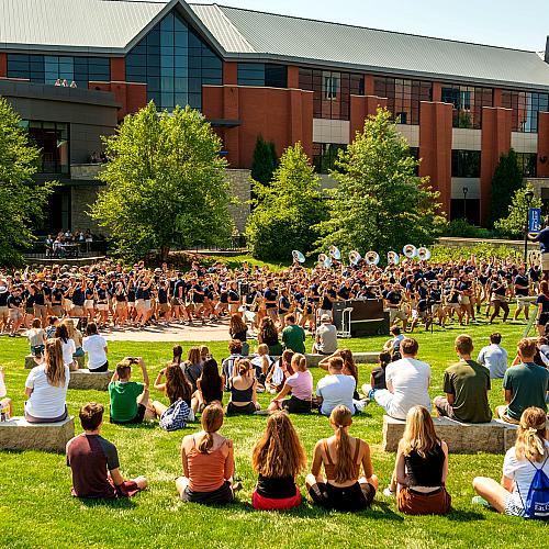 Students watch the Blugold Marching Band during Blugold Welcome