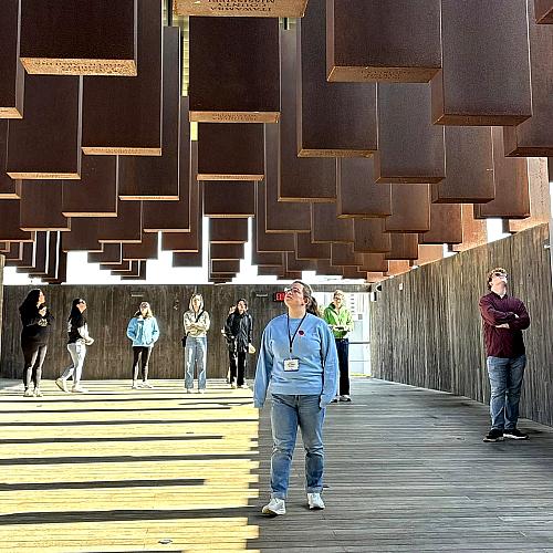 A student browses at a museum during the 2025 Civil Rights Pilgrimage.