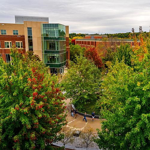 An aerial shot of campus and Centennial Hall in the fall. 