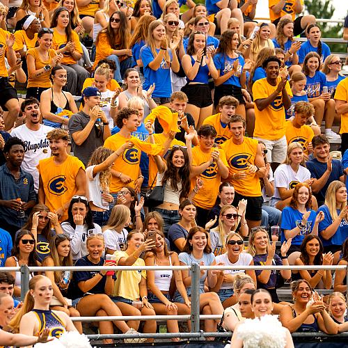 A large group of students wearing Blue and Gold cheer on the Blugold Football Team during the first home game of the 2026 seasons.